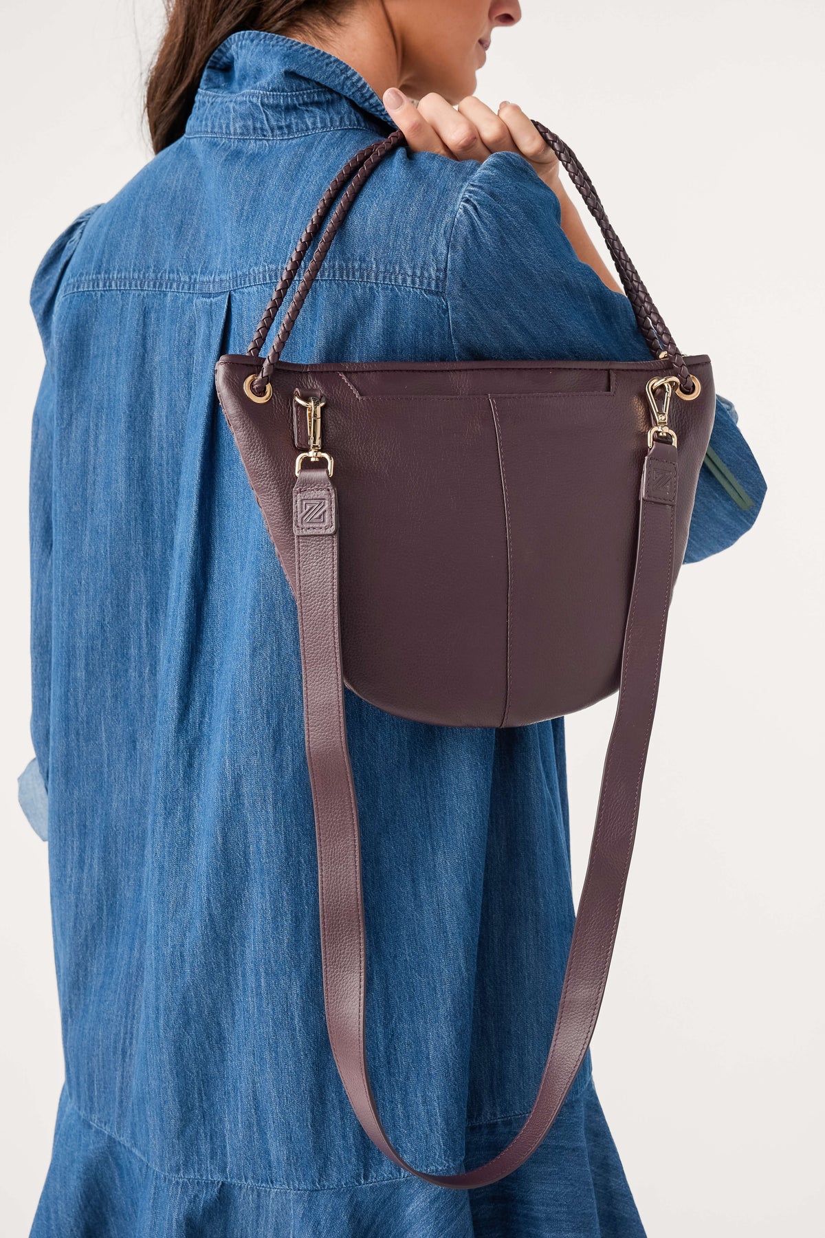 Wine half-moon woven bag with long adjustable crossbody strap and top handle