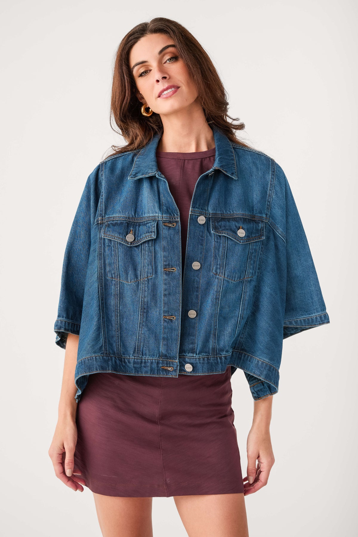 Oversized denim jacket with spread collar, chest pockets, button front, medium blue wash