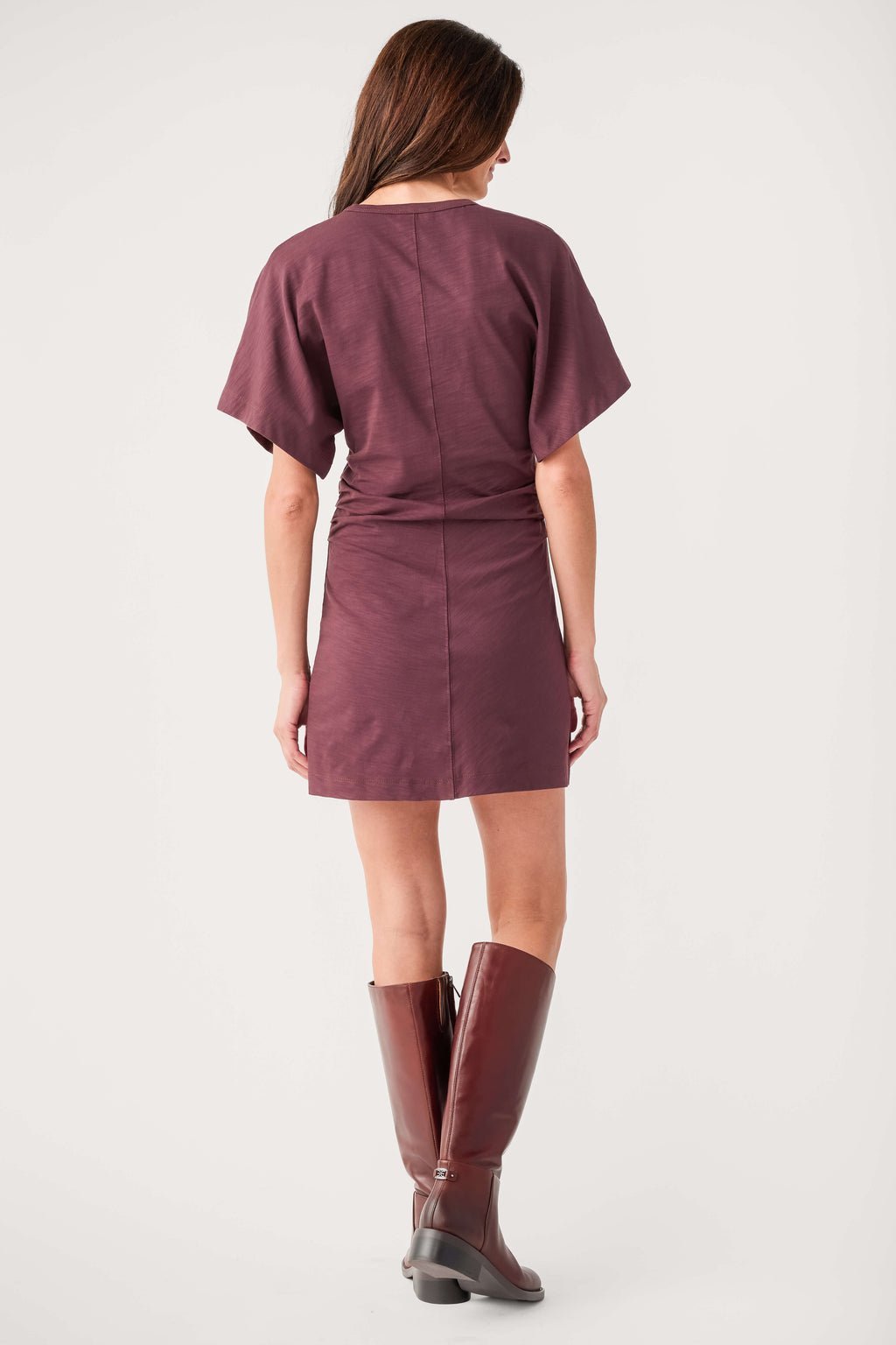 Back view of dark kimono-sleeve mini dress with short sleeves and seams