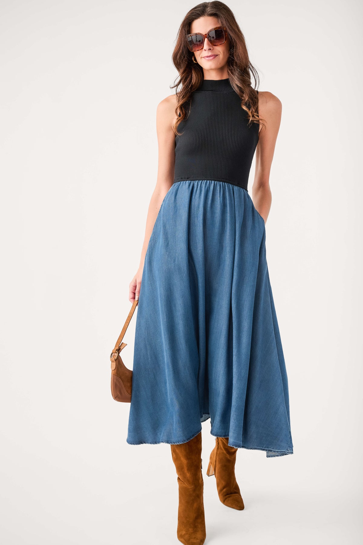 Sleeveless mock-neck denim maxi dress with black bodice and blue gathered skirt