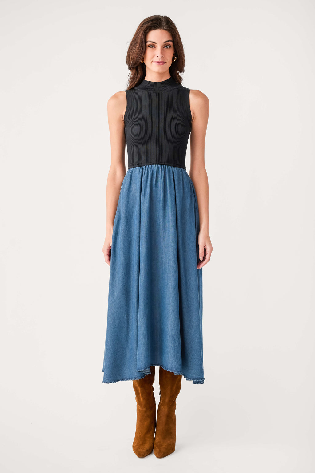 Fitted sleeveless mock-neck dress with black top and blue denim maxi skirt