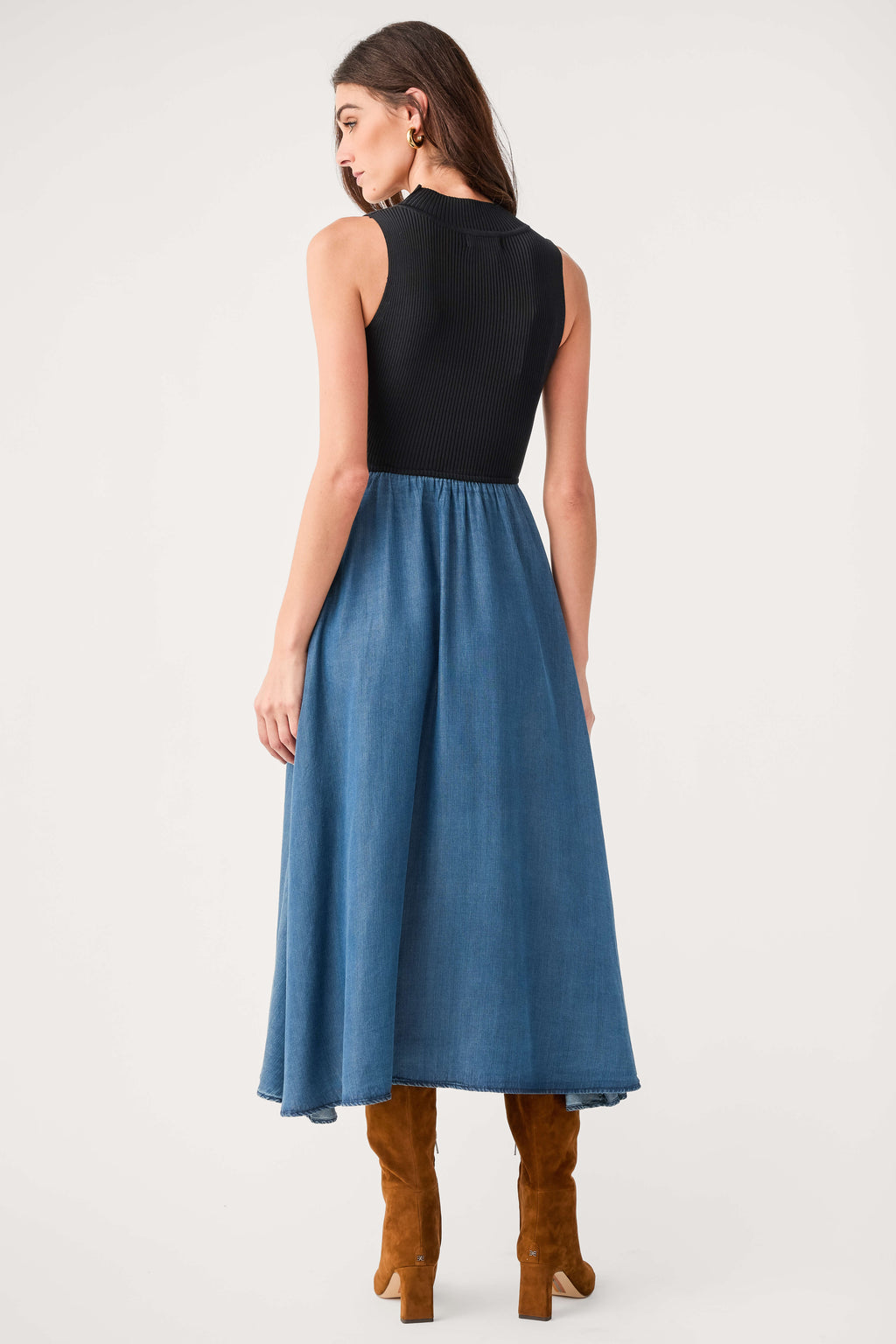 Back view sleeveless mock-neck denim maxi dress with blue skirt and black bodice