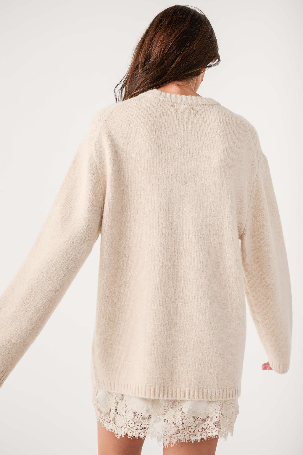 Frosted pearl knit crewneck sweater with ribbed cuffs and lace-trim back hem