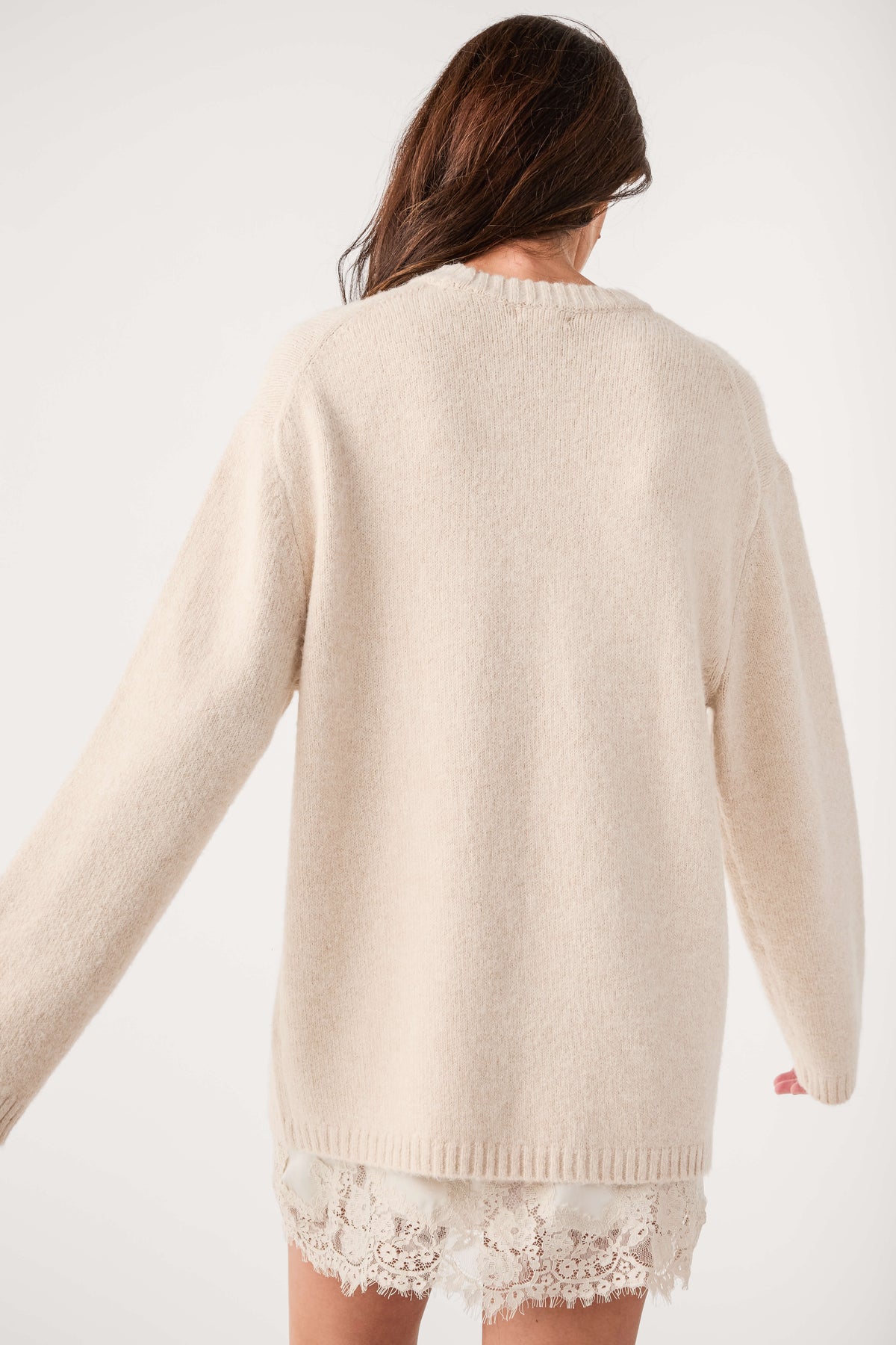 Frosted pearl knit crewneck sweater with ribbed cuffs and lace-trim back hem