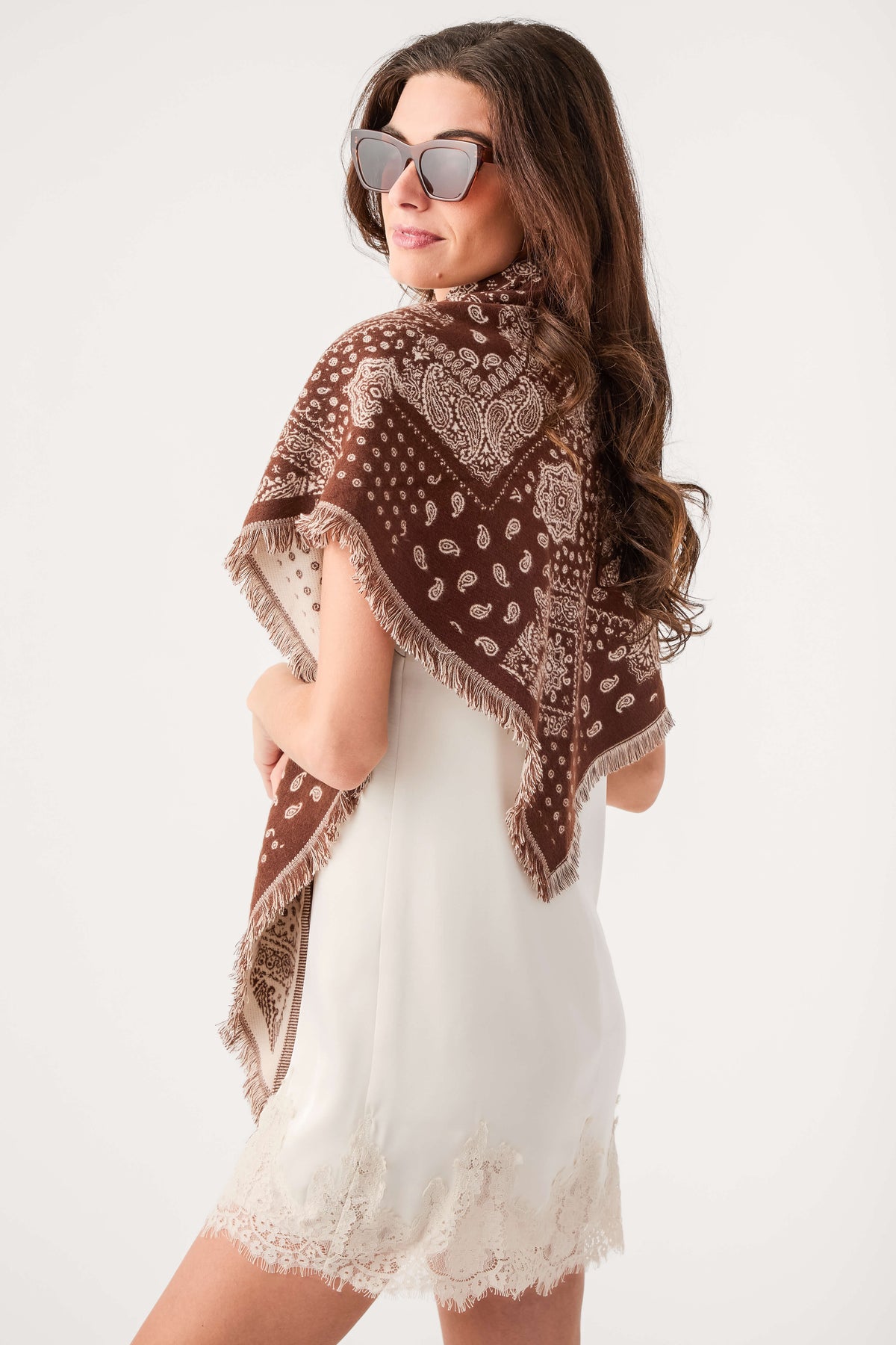 Brown bandana print scarf with dot-and-paisley pattern and fringed edges