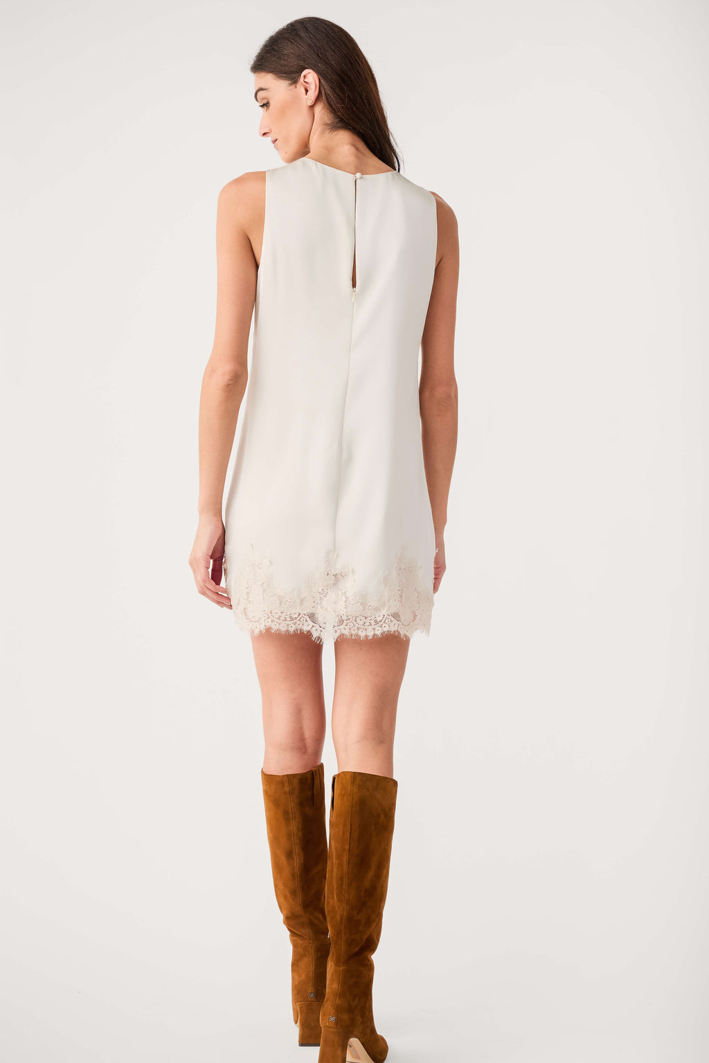 Back view of frosted pearl sleeveless mini dress with lace-trim hem