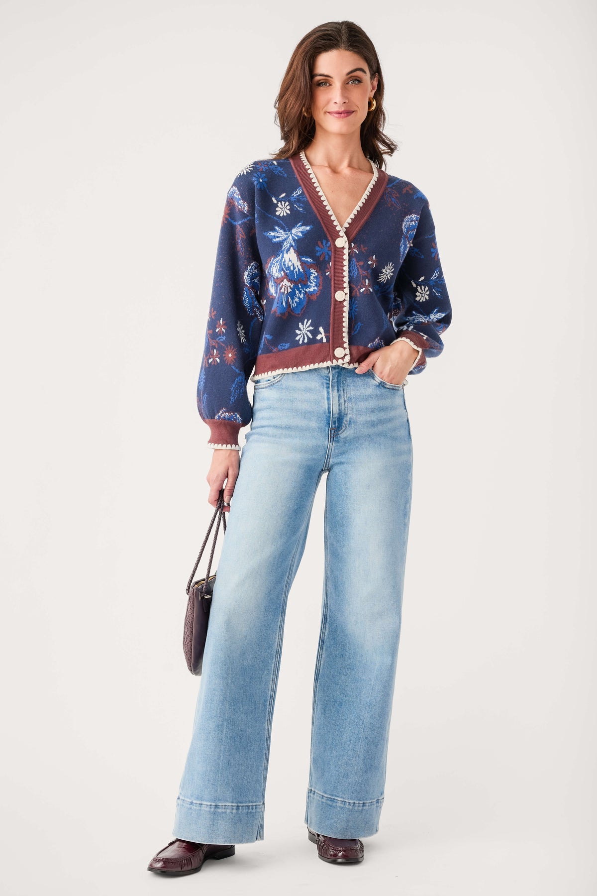 Medium wash wide-leg denim jeans with wide hem, button front, and belt loops