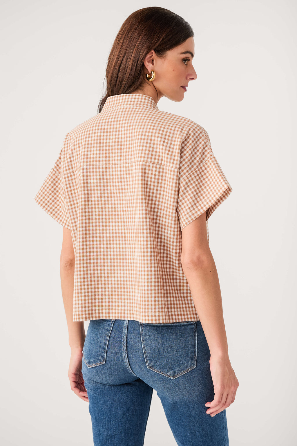 Tan-and-white gingham short-sleeve button-up top, back view