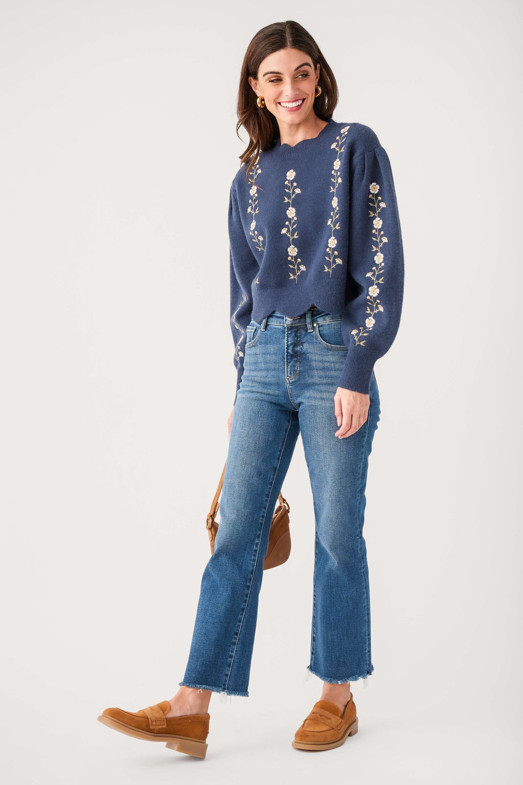 Navy embroidered sweater with scalloped hem and floral vine trim