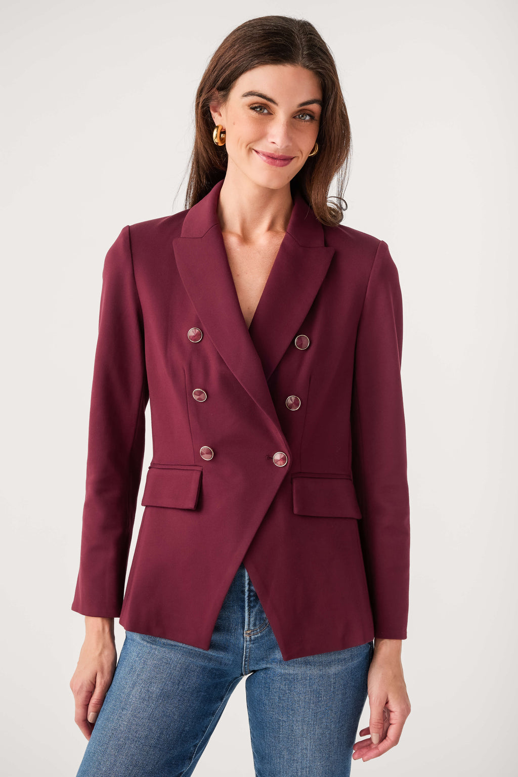 Burgundy double-breasted blazer with notch lapels and four-button front