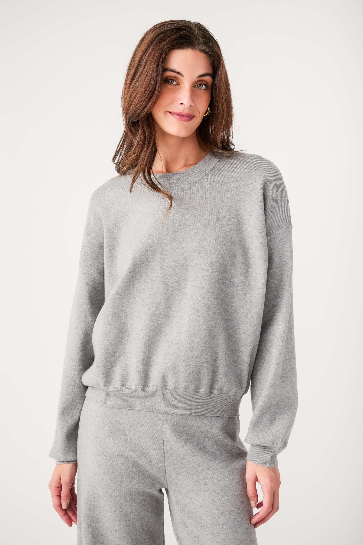 Relaxed crewneck sweater in heather gray with wide crew neck and ribbed waist hem