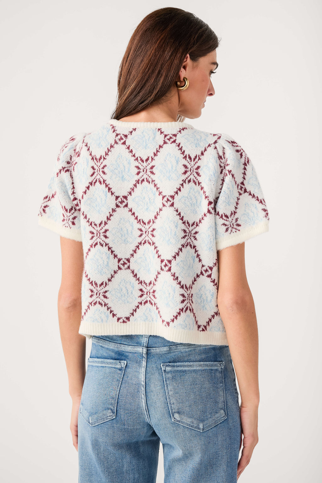 Ivory short-sleeve sweater top, back view, red and blue floral diamond knit pattern