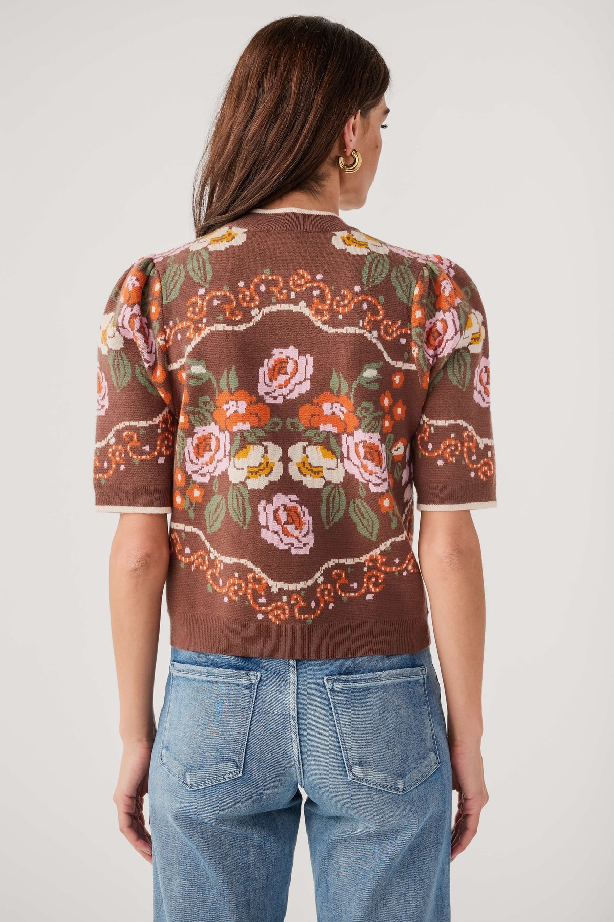Brown floral knit sweater top, back view with short sleeves and crew neck