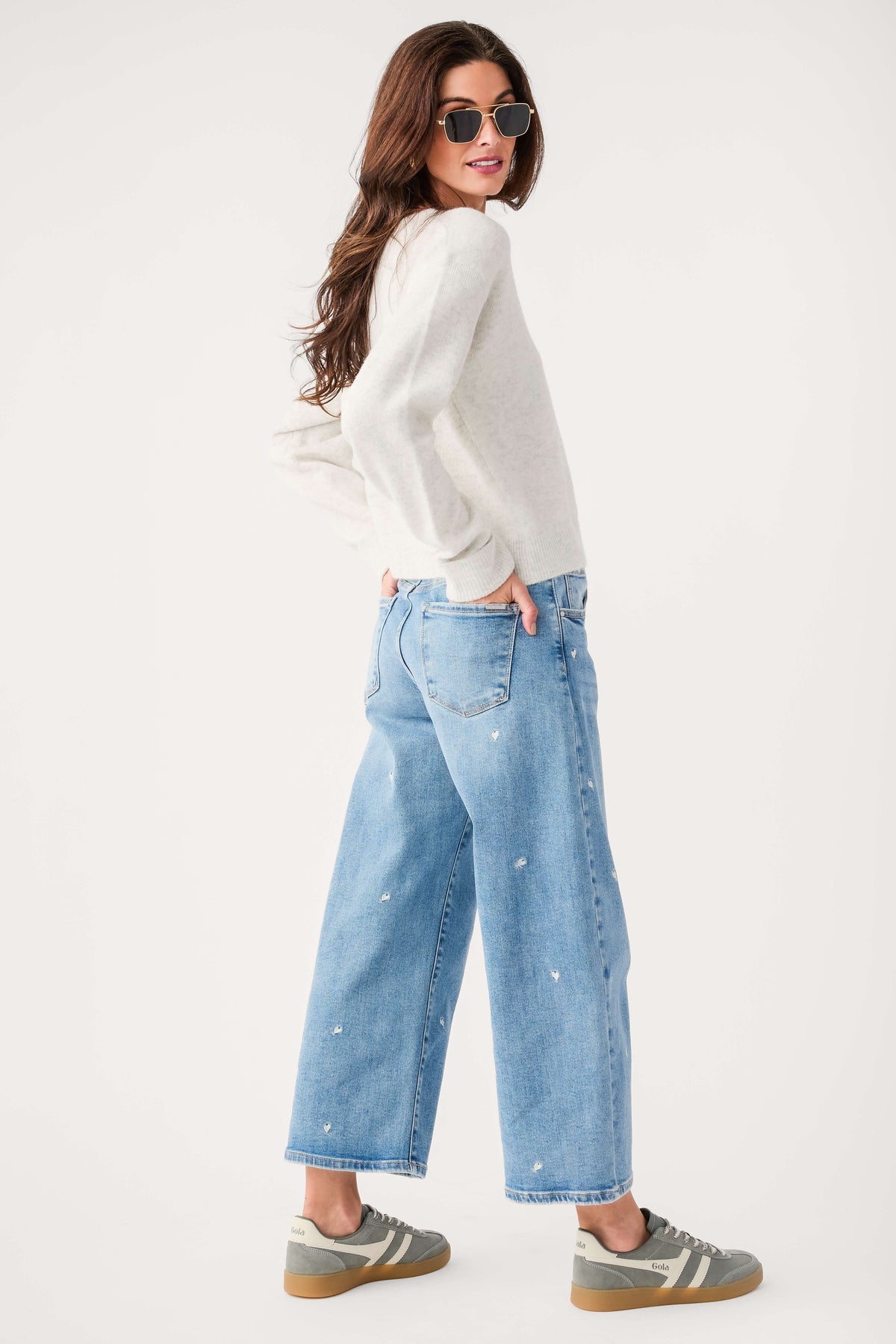 Light blue cropped barrel jeans with embroidered speckle design and wide barrel legs