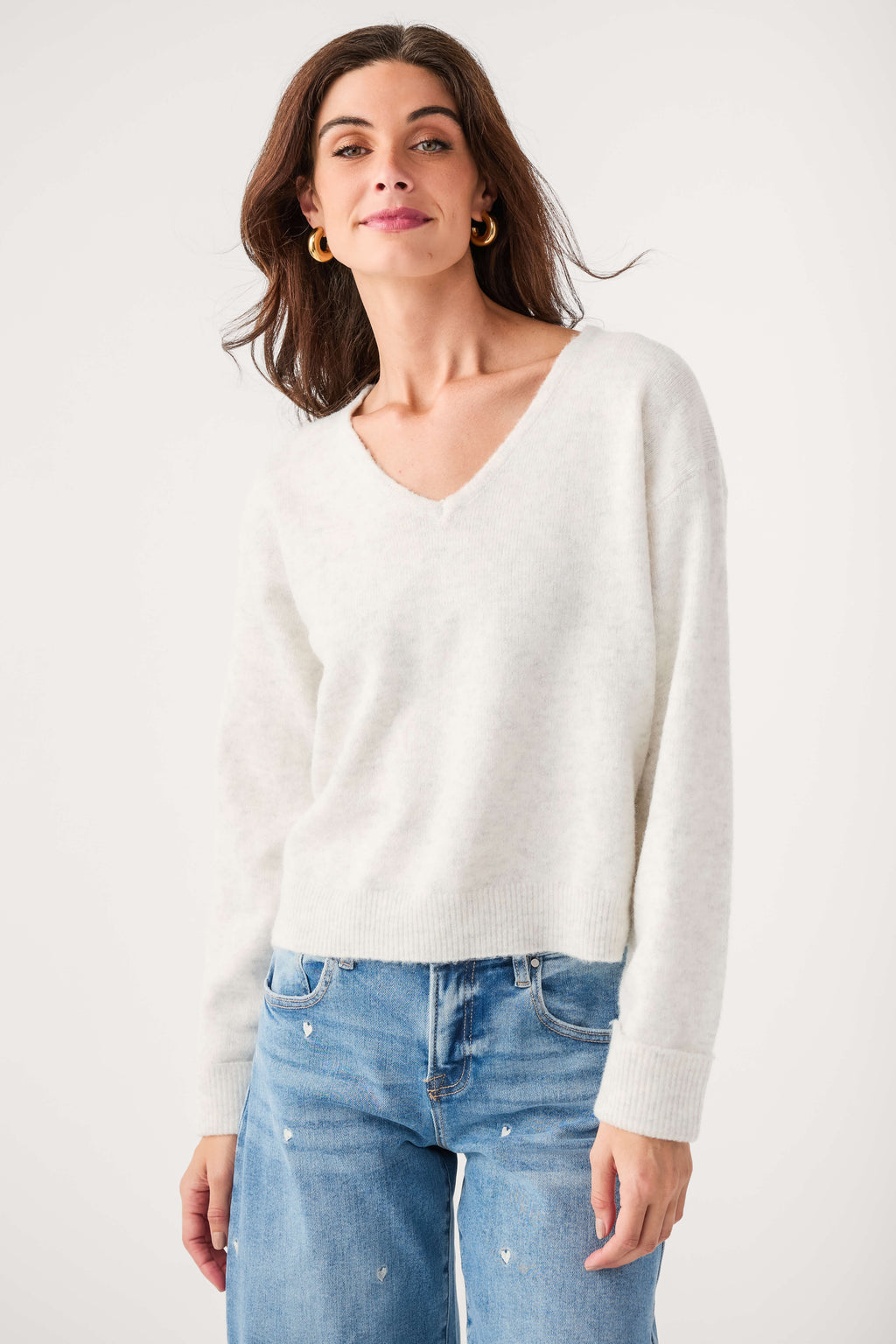 Light gray V-neck sweater knit top with ribbed cuffs and hem