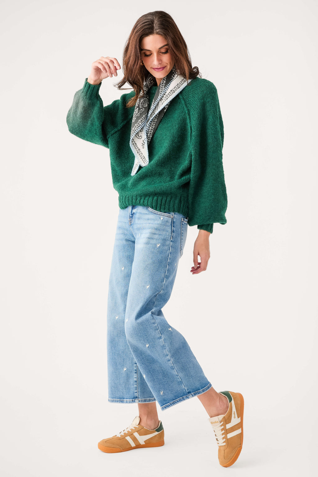 Forest green raglan sleeve sweater with crew neck and ribbed cuffs