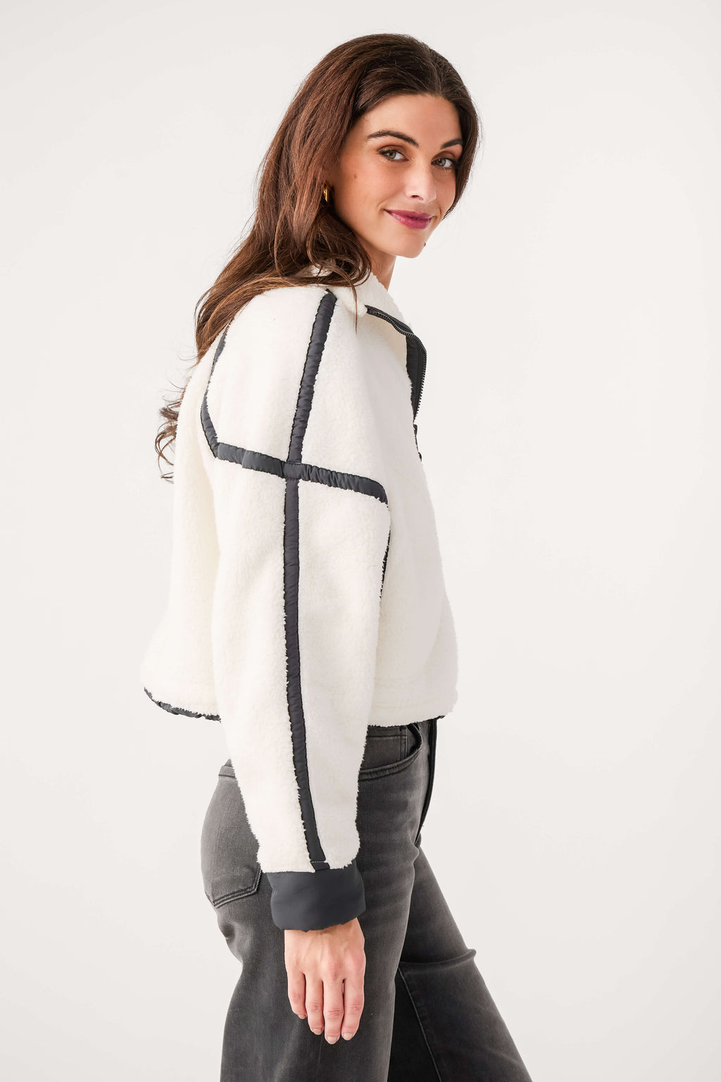 White fleece 1/2-zip pullover with black contrast sleeve panel and fitted cuffs