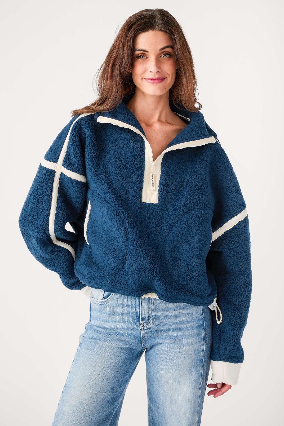 Navy blue half-zip fleece pullover with white cross-panel accents