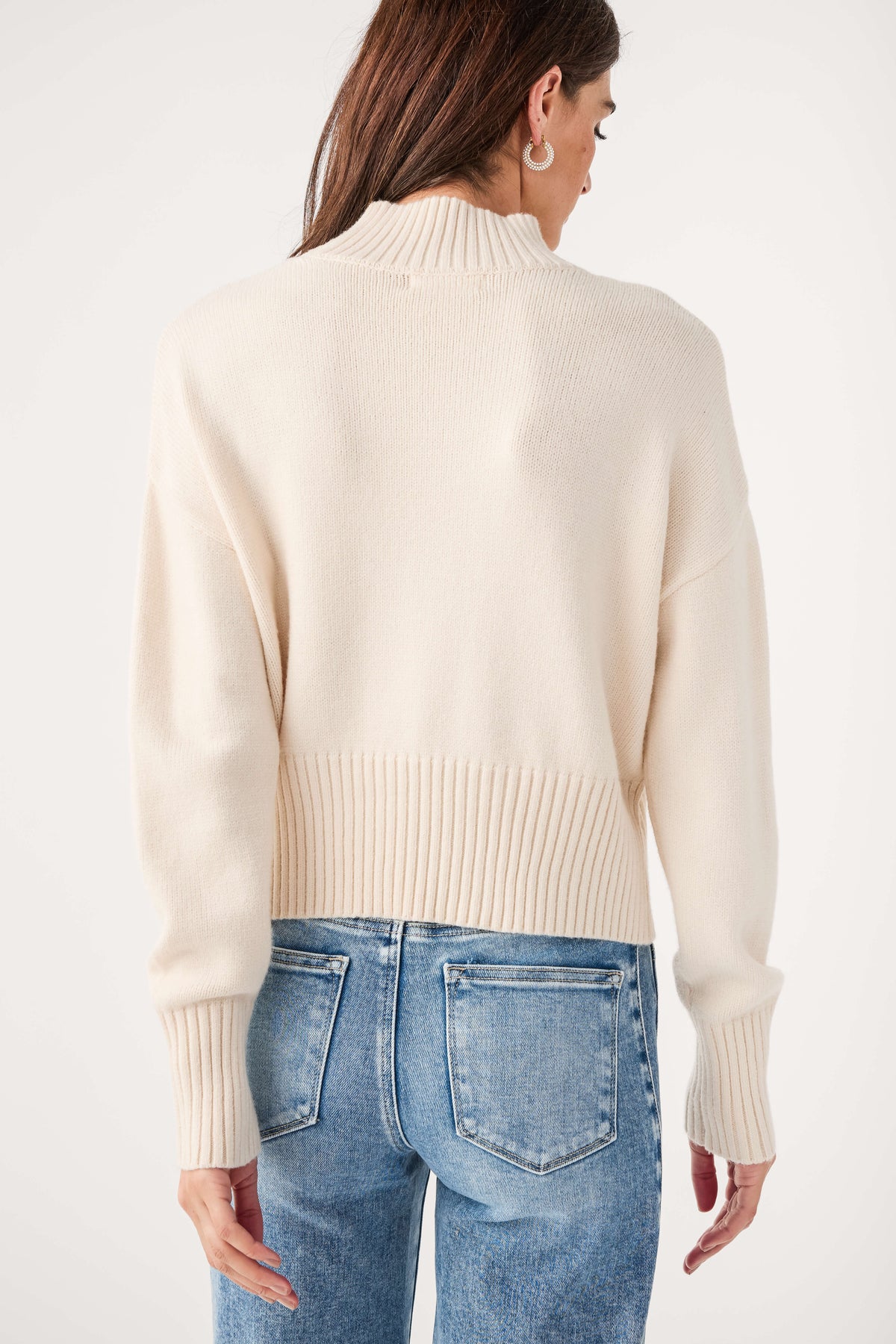 Ivory mock neck sweater, back view with ribbed hem and cuffs