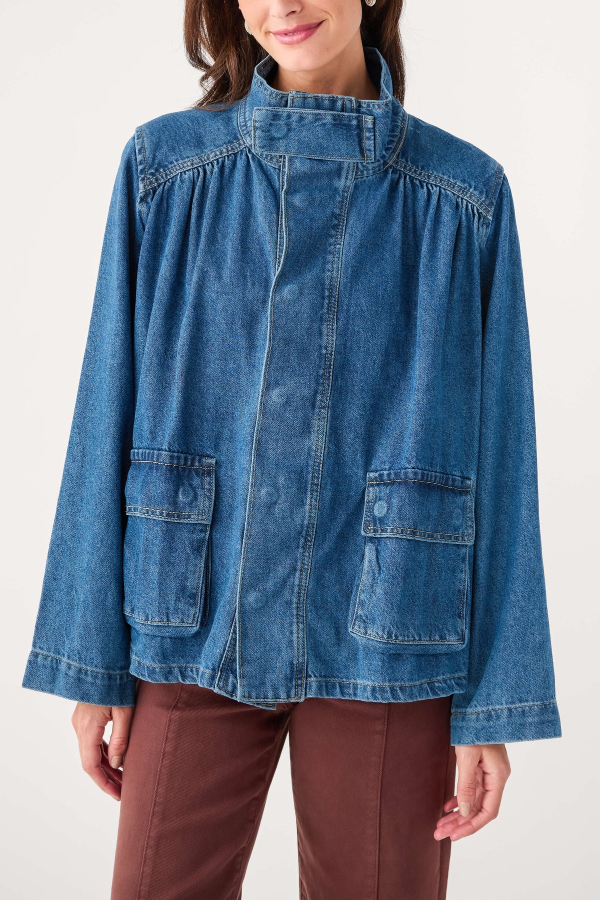 Dark blue denim jacket with gathered yoke and front patch pockets