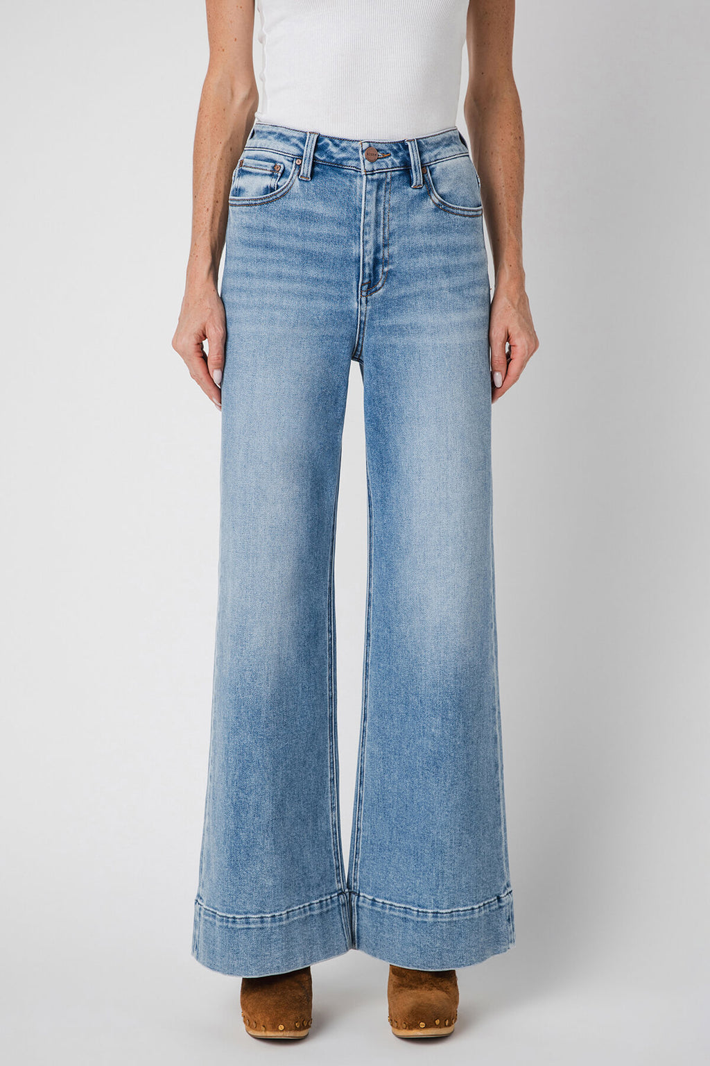 Light blue wide-leg jeans with button fly, belt loops, and front scoop pockets