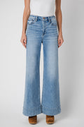 Light blue wide-leg jeans with button fly, belt loops, and front scoop pockets