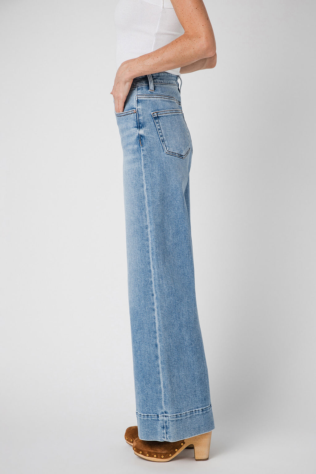 Light blue wide-leg jeans with back welt pockets and long straight flared leg