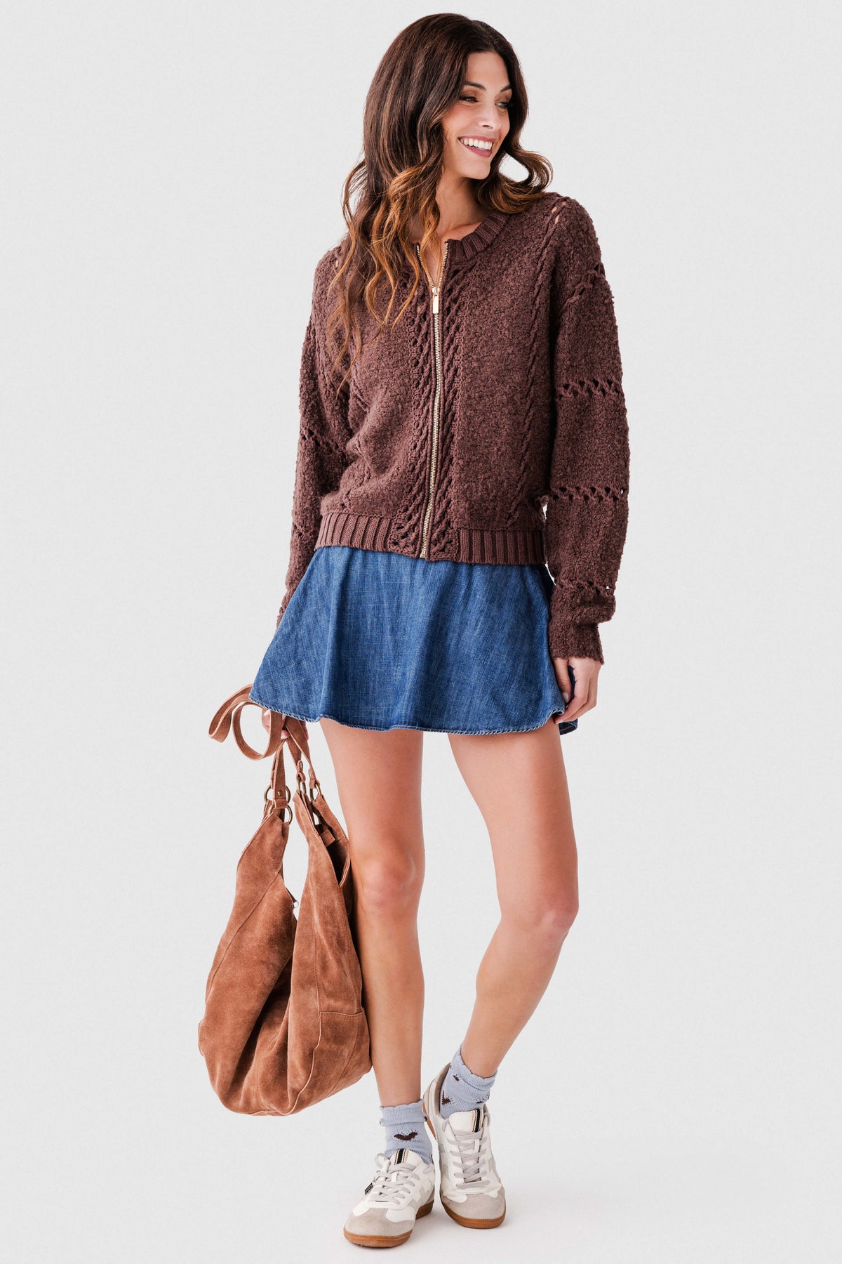 Blue denim skort, side view: elastic waistband and A-line skirt overlay