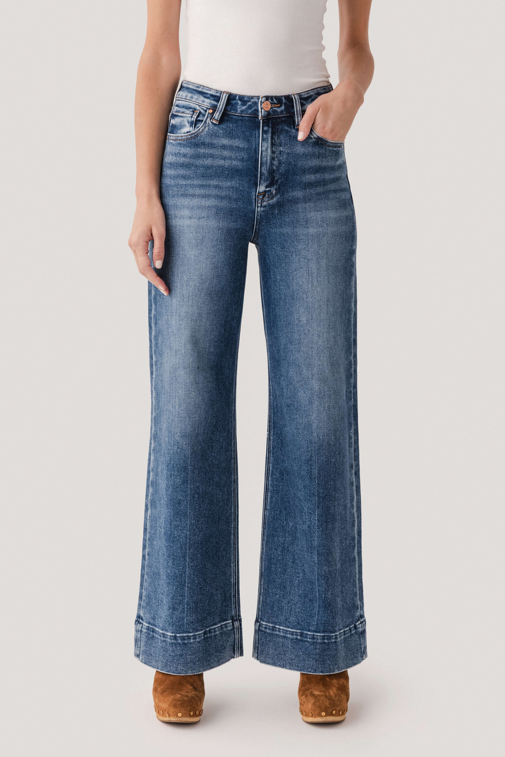 Dark-wash wide-leg denim jeans with button fly, belt loops, and front scoop pockets