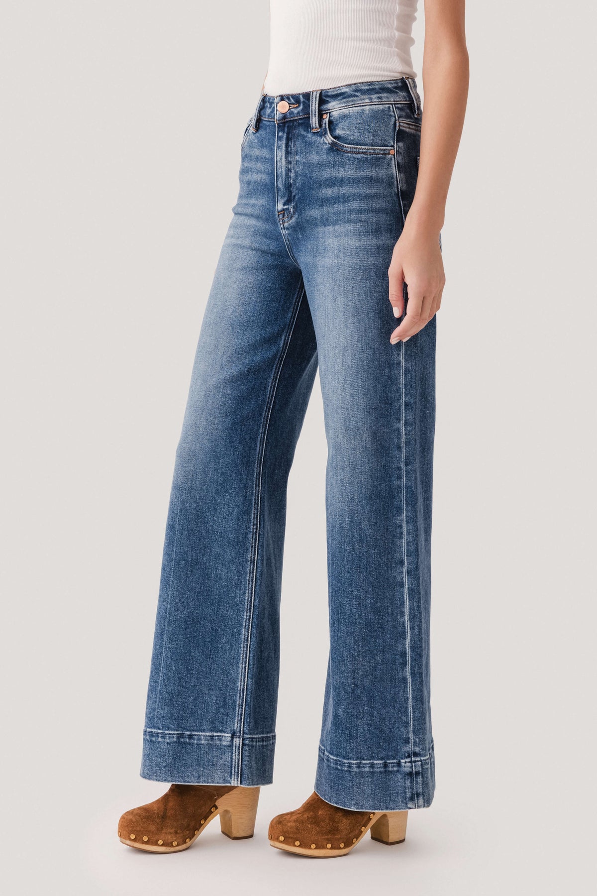 Medium-wash denim wide-leg jeans with belt loops and classic five-pocket styling