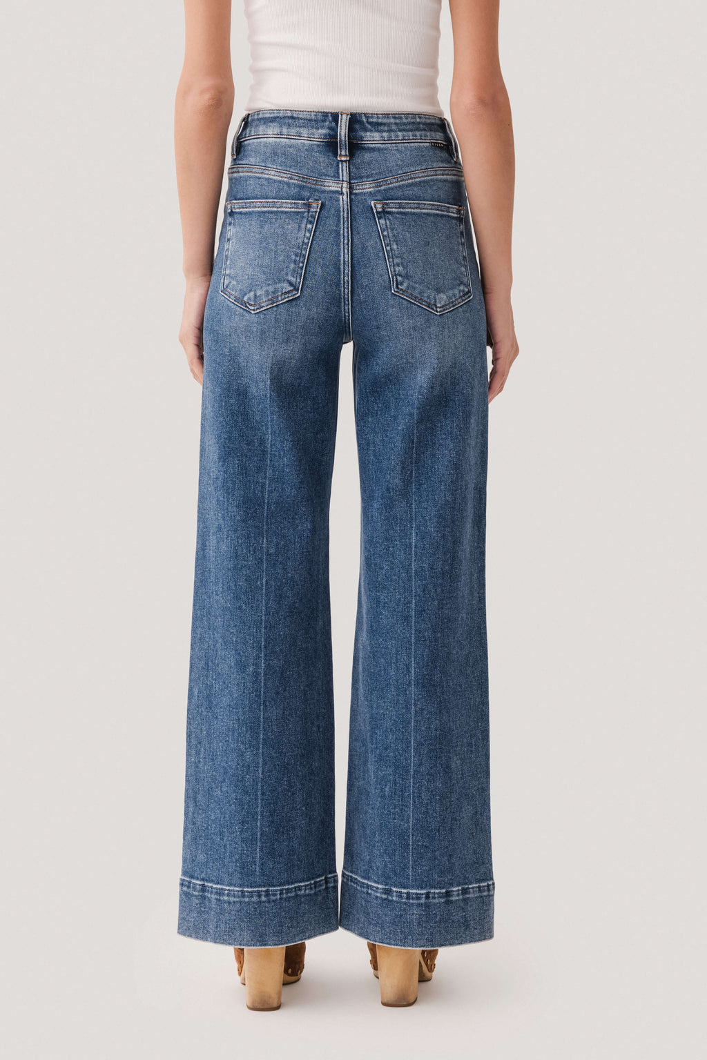 Medium-wash denim wide-leg jeans with two back pockets and straight wide hem