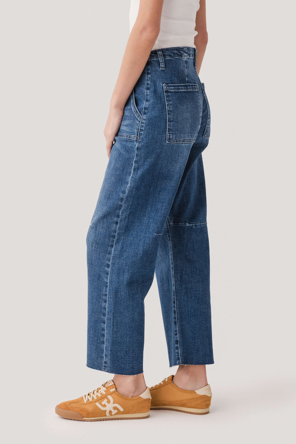 Dark wash utility pocket barrel jeans with slanted patch pockets, relaxed barrel leg