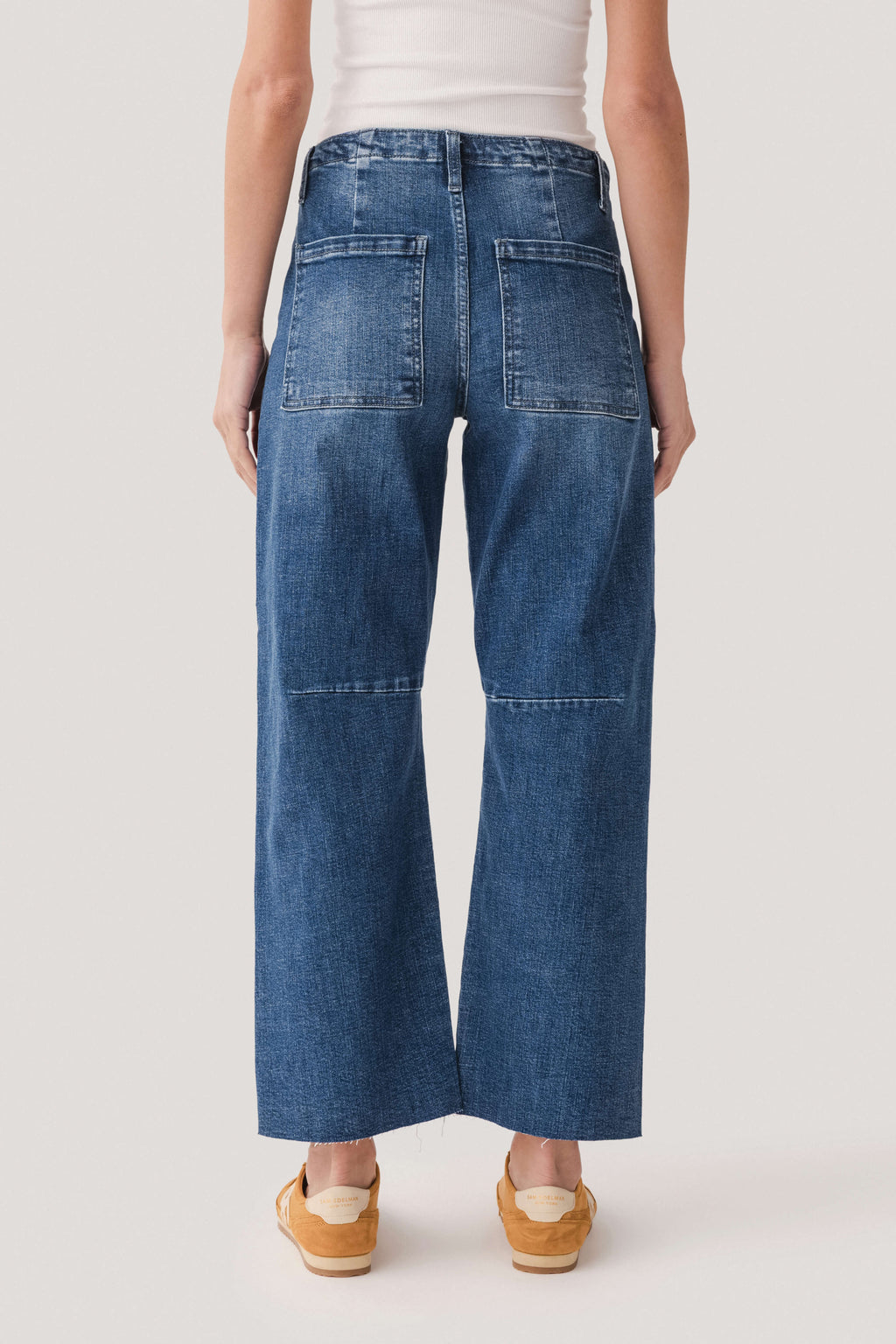 Dark wash barrel jeans back view, yoke seam and two back patch pockets