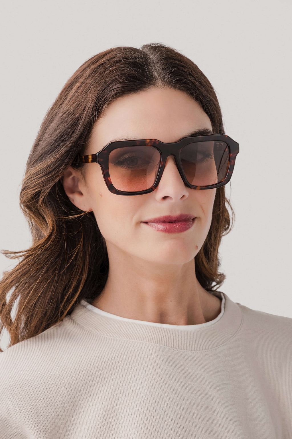 Rectangular acetate sunglasses with dark tortoise frame and dark square lenses