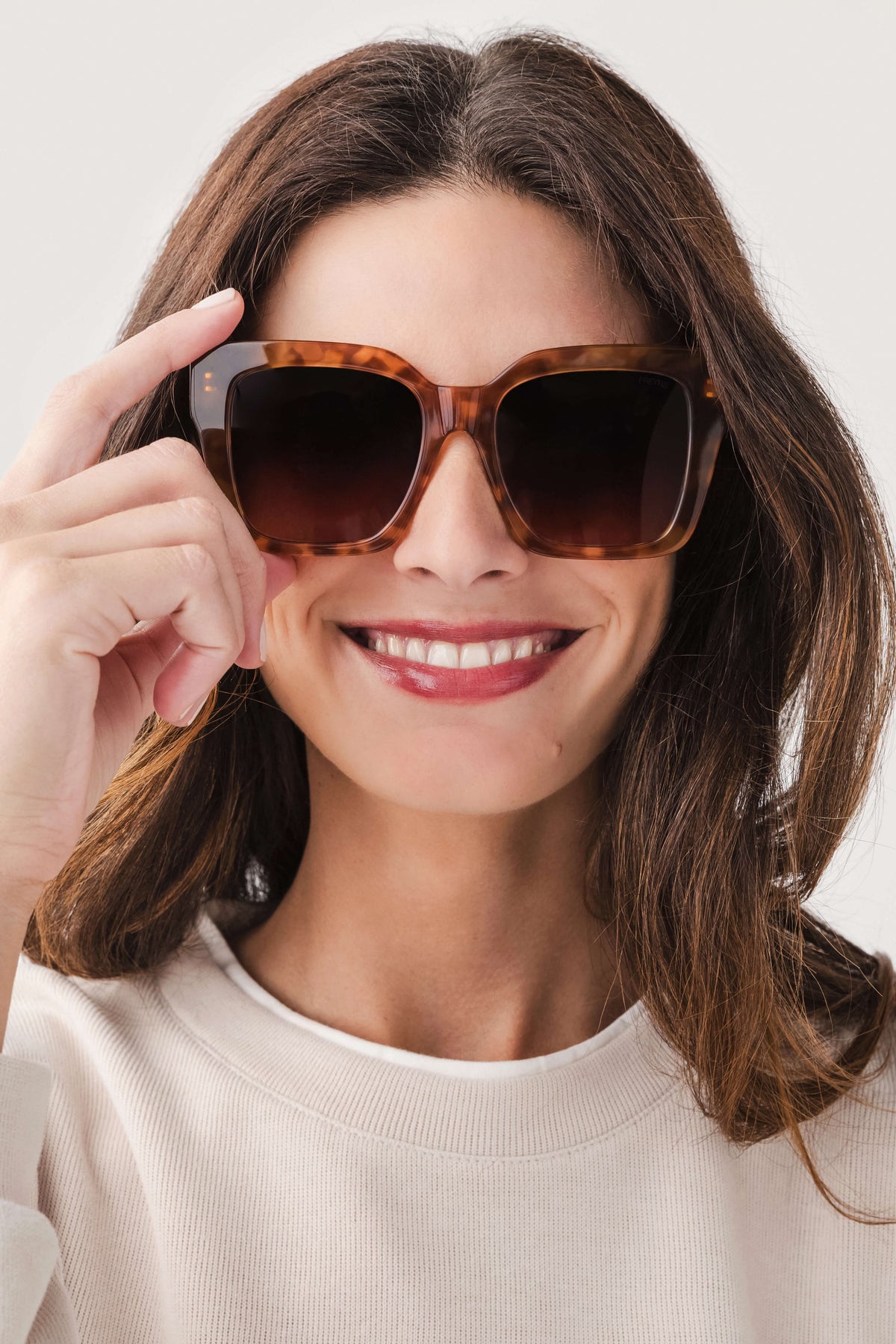 Oversized brown acetate sunglasses with dark tinted lenses, square frames