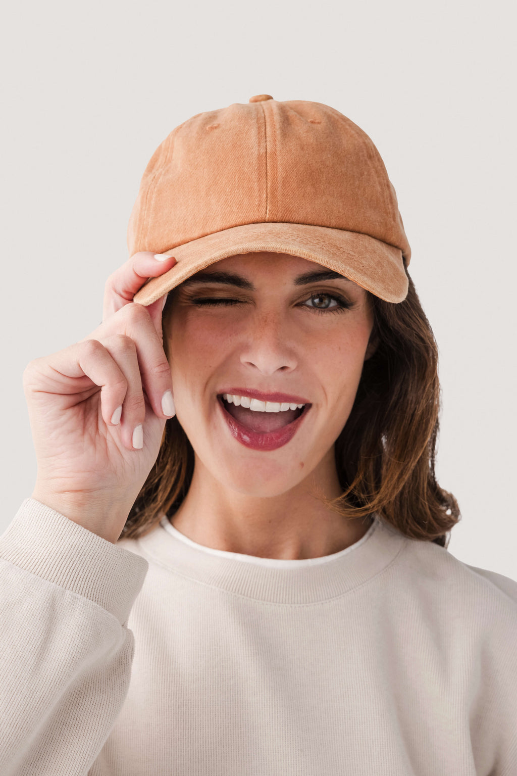 Amber orange classic baseball cap with curved brim and stitched panels