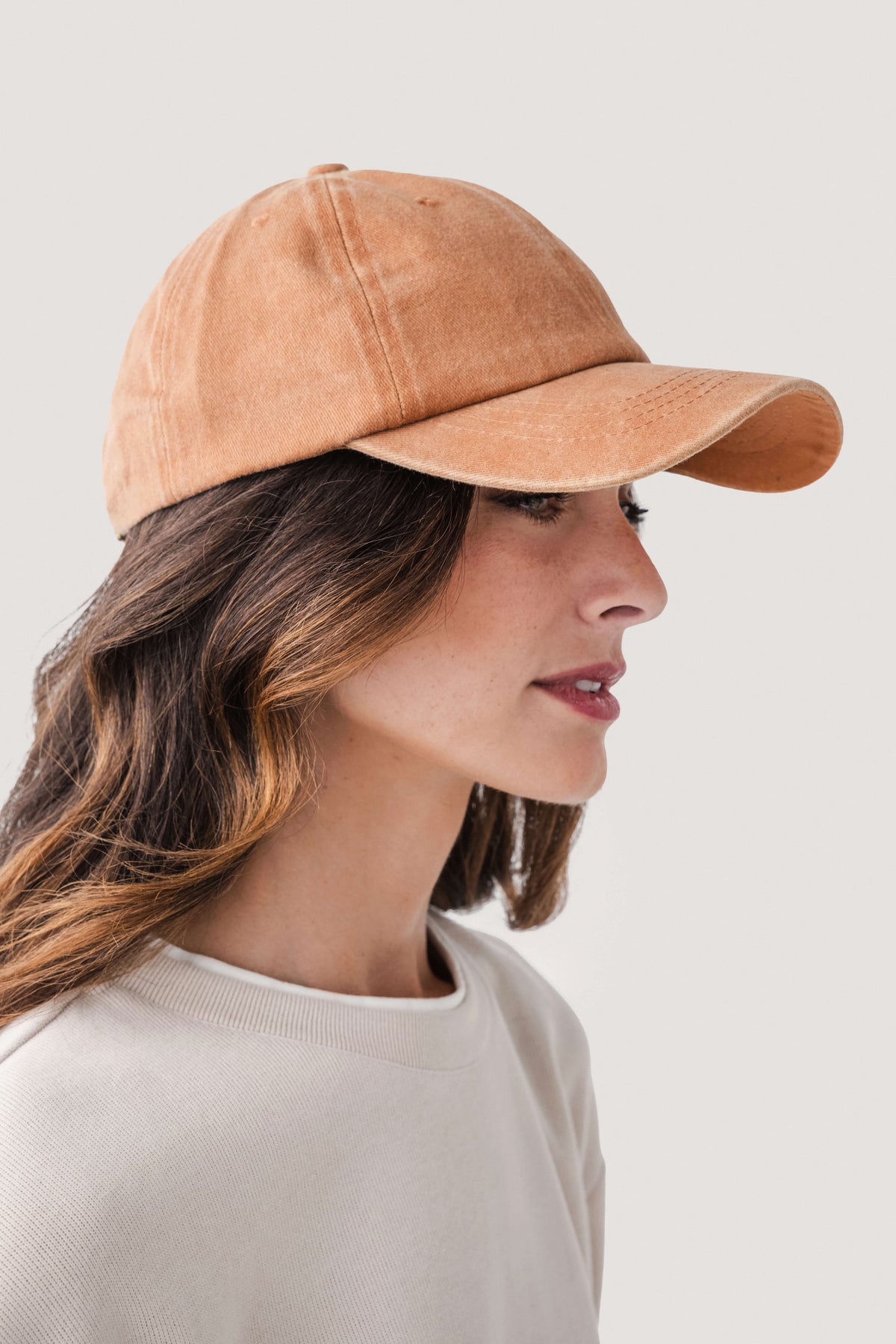 Amber orange classic baseball cap, side view with curved brim