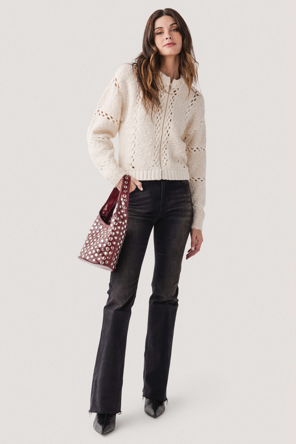 Deep red studded hobo bag with silver-tone metal studs and short handles