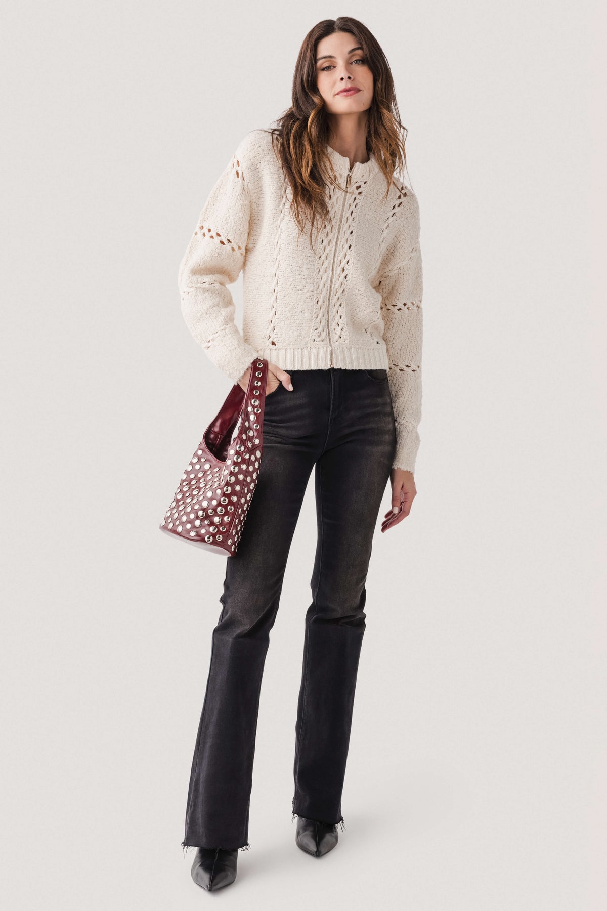 Deep red studded hobo bag with silver-tone metal studs and short handles