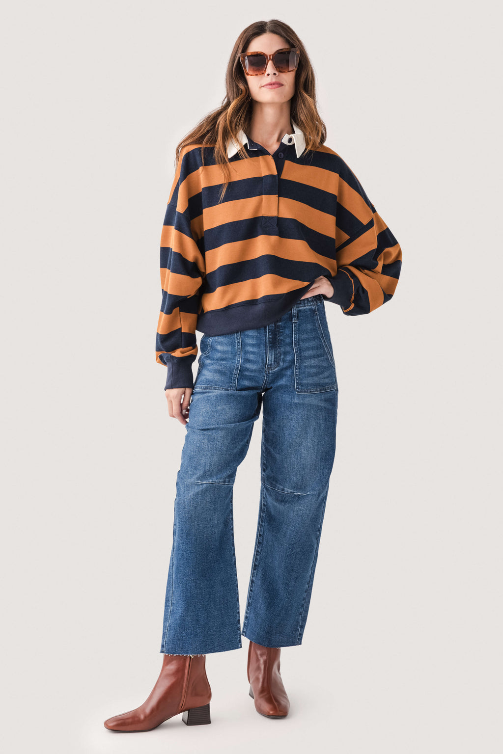 Dark wash barrel jeans with utility patch pockets and relaxed wide leg