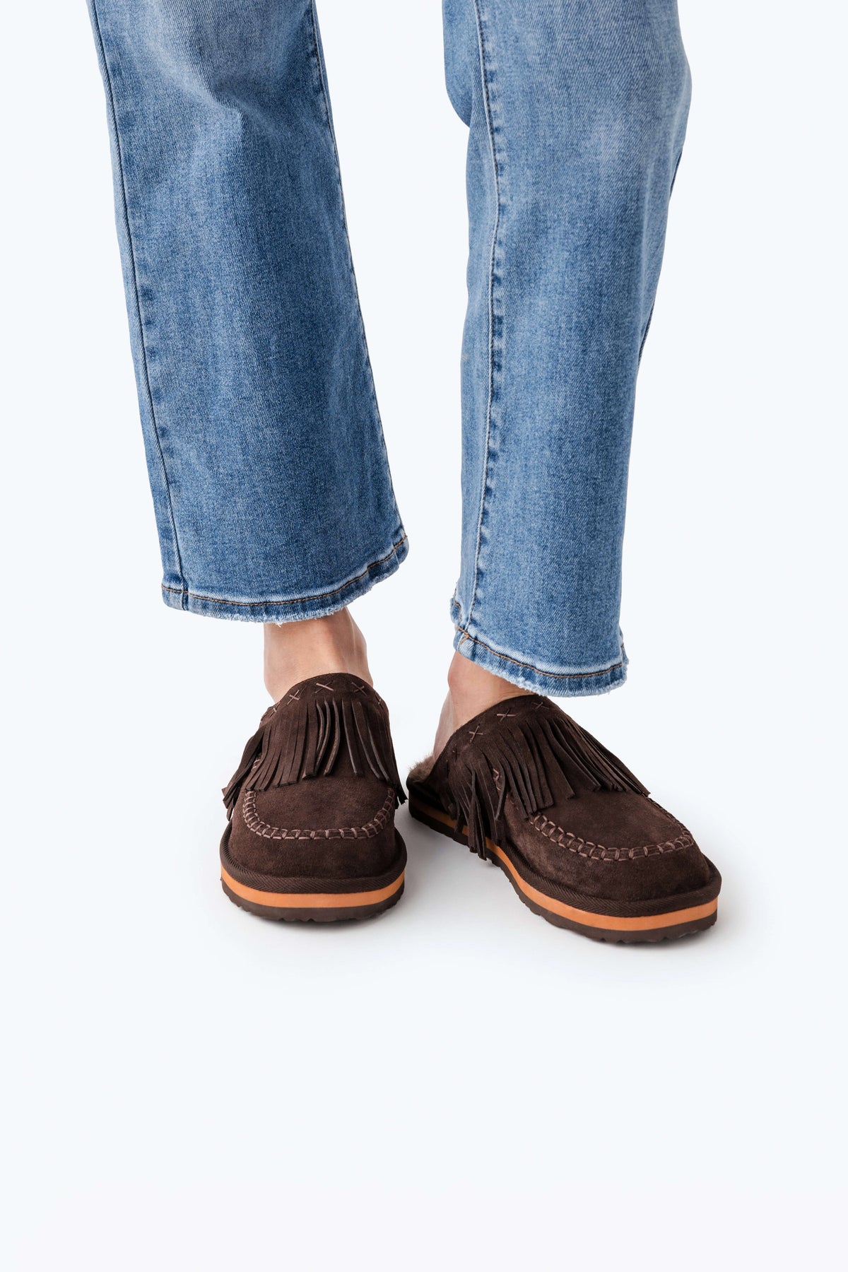 Chocolate brown suede fringe mules with lace-trim stitching, flat sole