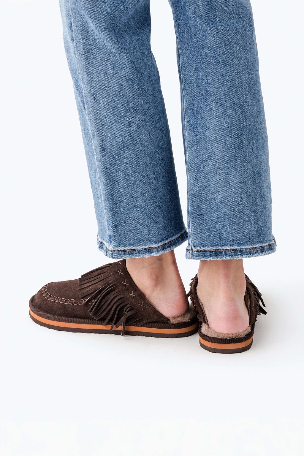 Chocolate suede fringe mules with tassel detail and low profile sole
