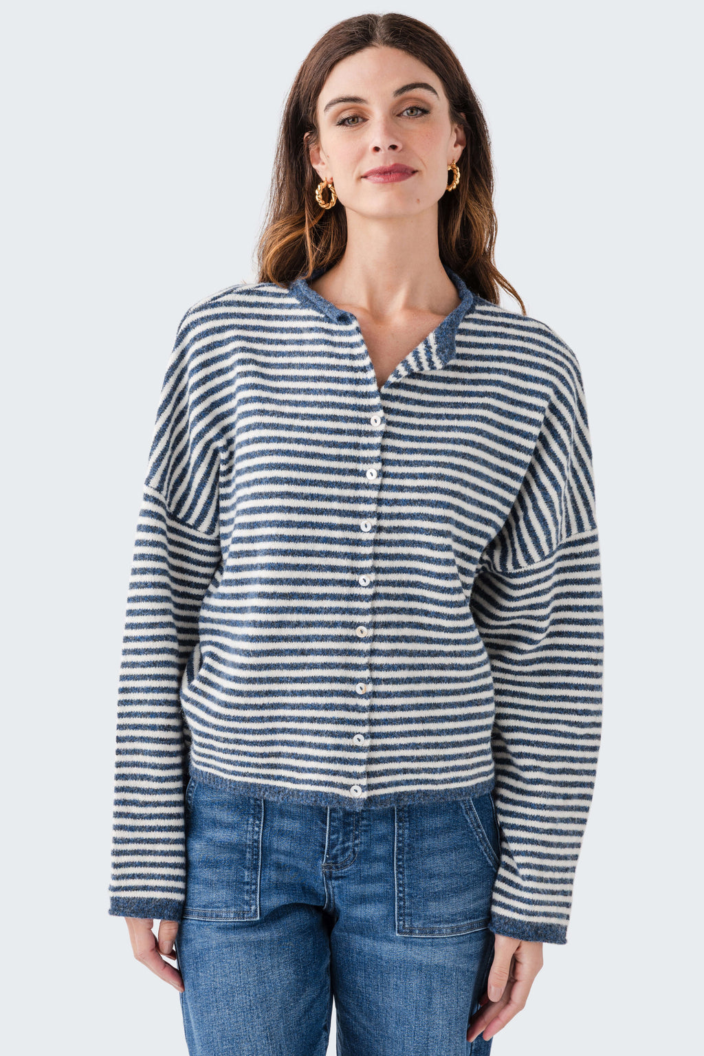 Striped knit cardigan with button front and long sleeves; blue-and-white horizontal stripes