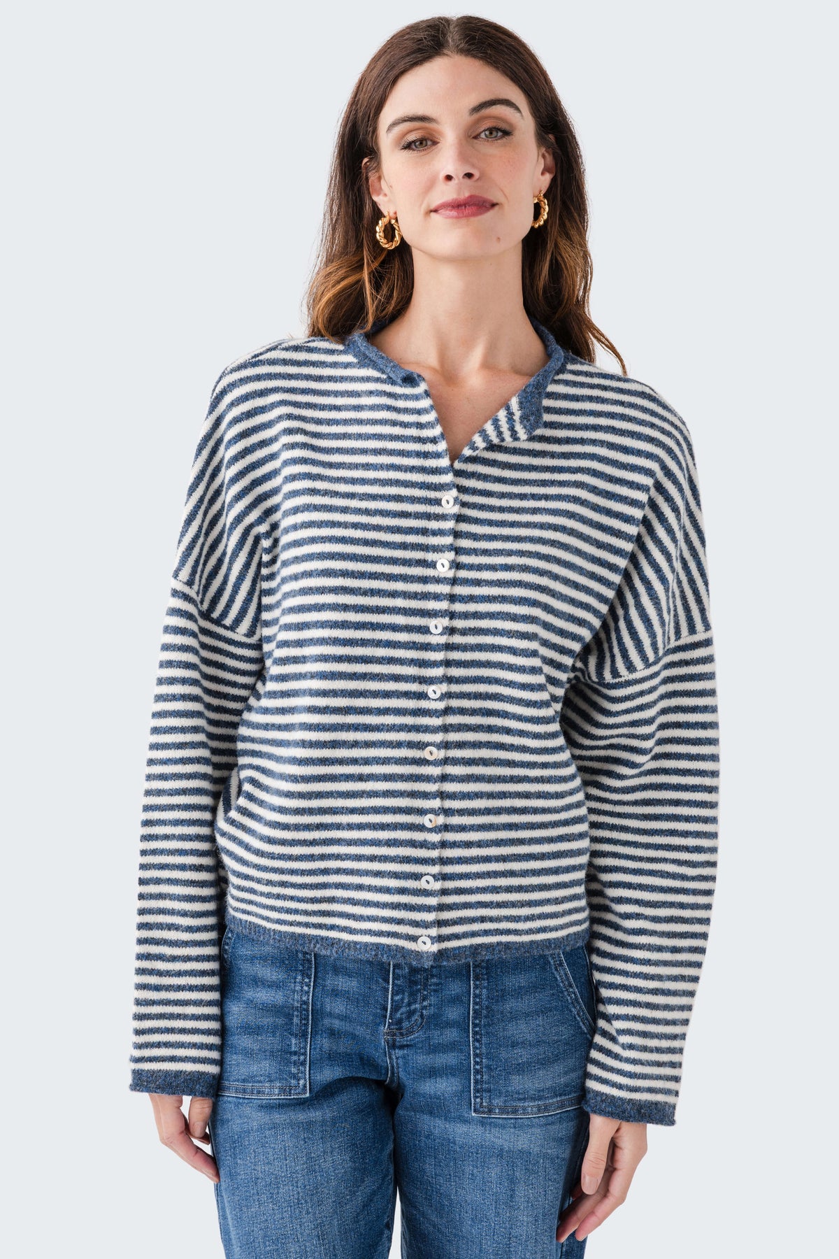 Striped knit cardigan with button front and long sleeves; blue-and-white horizontal stripes