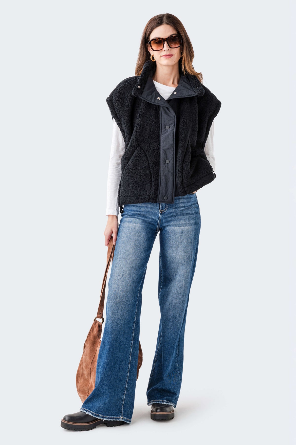 Black sherpa fleece vest with zip-front and stand collar