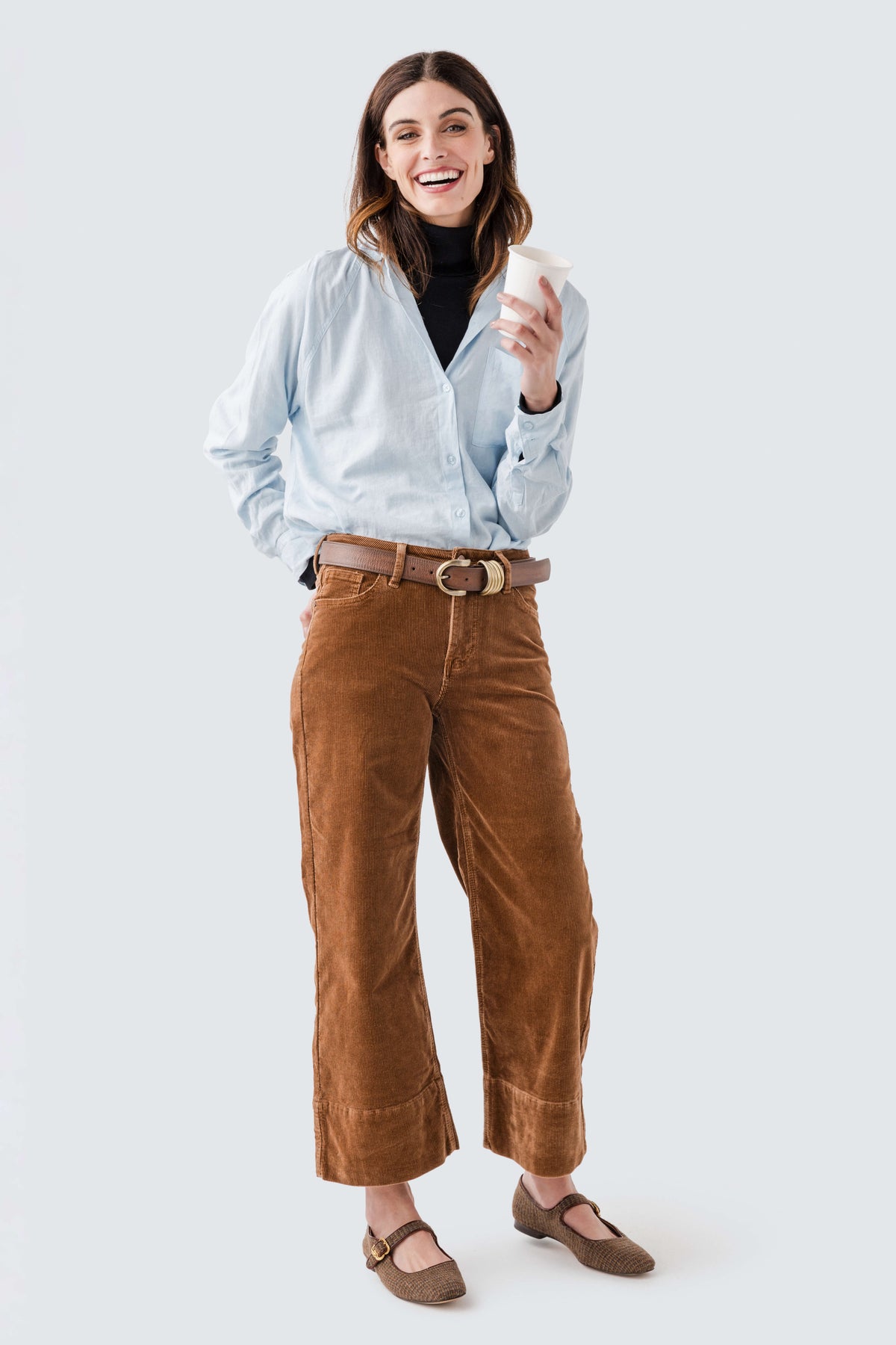 Light blue button-up shirt with V-neck and long sleeves