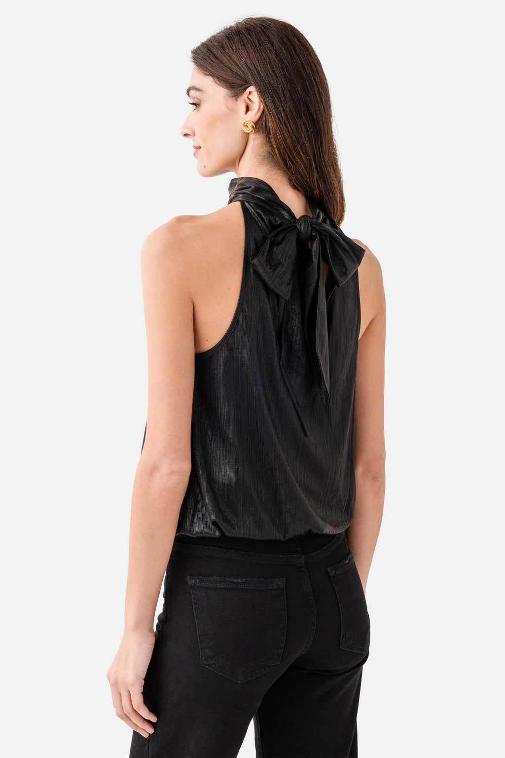 Black metallic halter top with open back and bow tie at neck