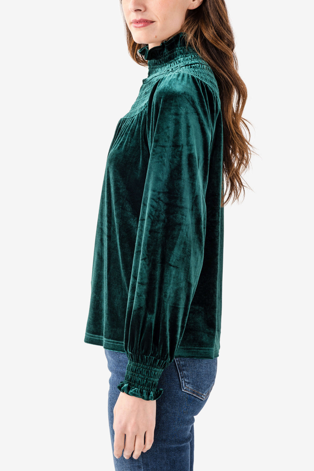 Emerald velvet smocked high-neck top with long sleeves, side view