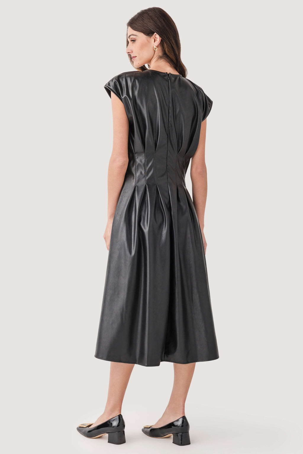Black faux-leather pleated midi dress, back gathered seams, sleeveless.