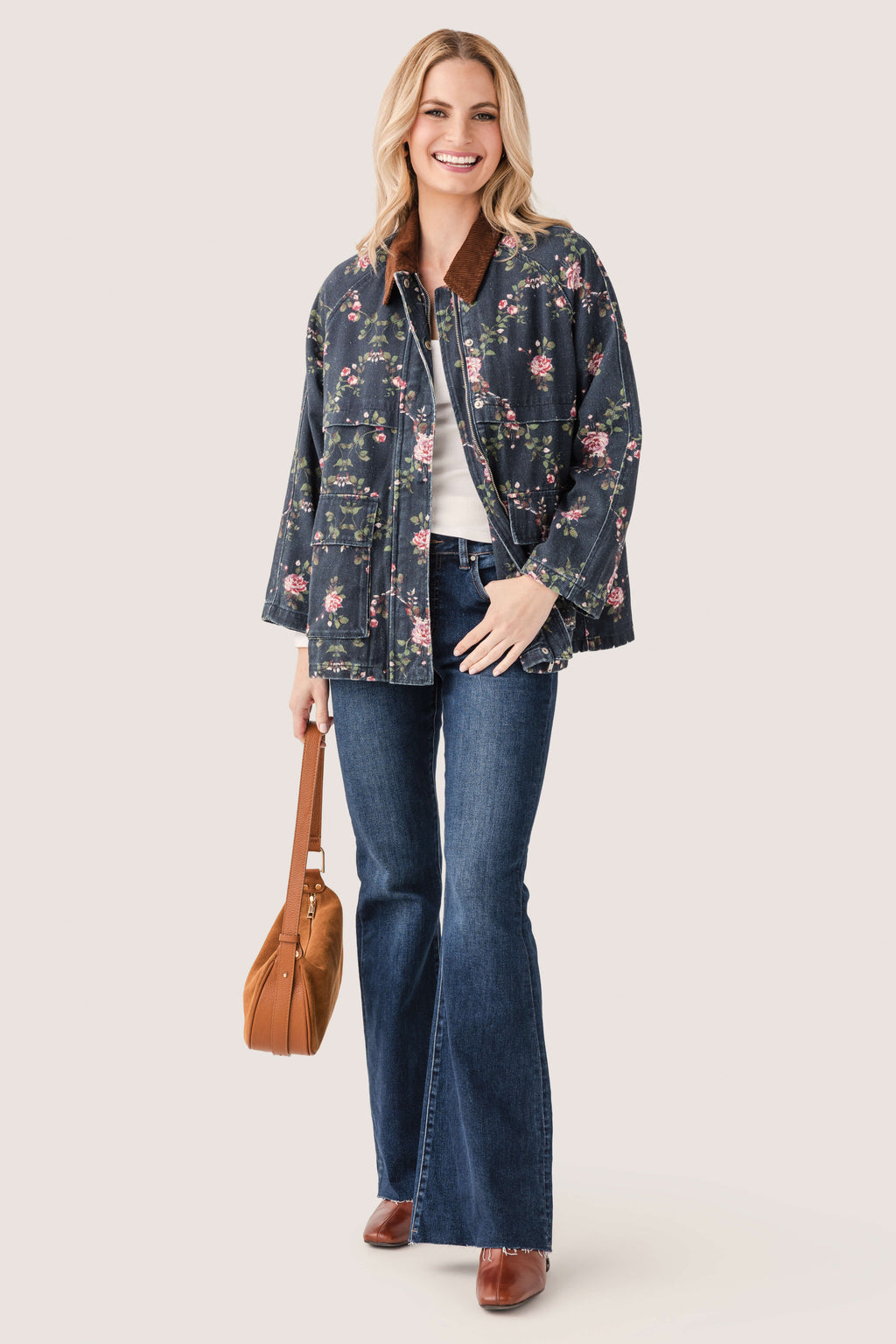 Floral utility jacket with half sleeves, full zipper, and chest pocket, dark navy floral print.
